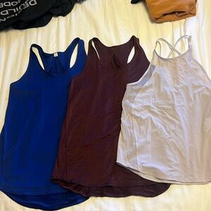 Lululemon tanks - 3, all size 6. Blue, wine and off white